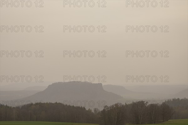 Large amounts of Sahara dust obscure the sun and cloud the distant view to Lilienstein and