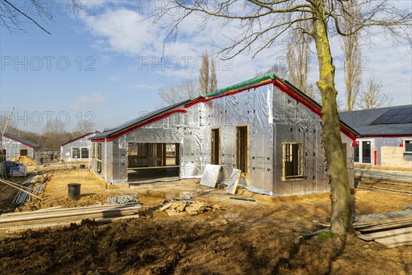 Building site single storey bungalow homes, timber frame construction, thermal insulation, Ufford,