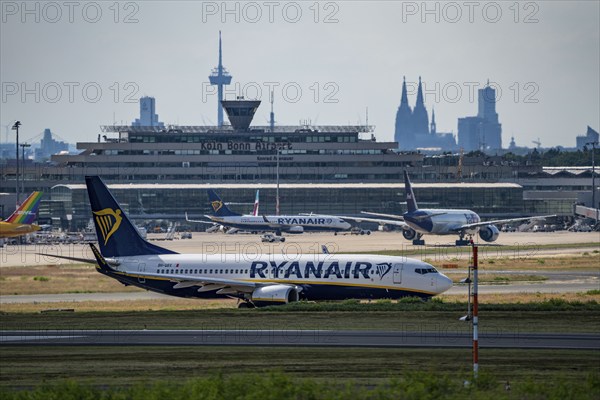 Cologne-Bonn Airport, CGN, Ryanair Boeing 737 on the taxiway, tower at the terminal of German Air