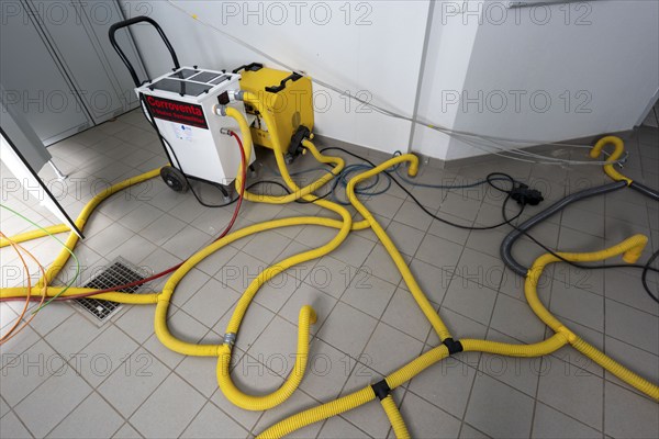 Water damage restoration, dehumidification, after flooding of a building, vacuum drying