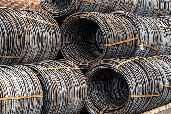 Steel wire, coils, waiting for further processing in the Rhine-Ruhr harbour in Mülheim an der Ruhr,