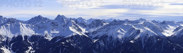 Alpine panorama with snow-covered mountain peaks in winter. Taken in the ski resort of Serfaus Fiss