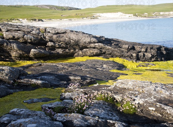 Rocky headland and sandy beach at Bagh a Deas, South Bay, Vatersay island, Barra, Outer Hebrides,
