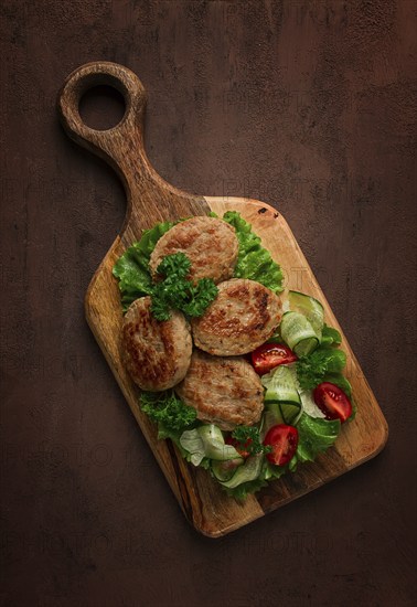 Fried cutlets, turkey, with vegetable salad, top view, no people