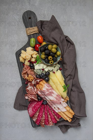 Appetizer, assortment, set, sausage, and cheese, on a wooden board, top view, no people