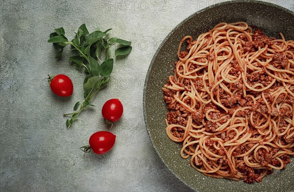 Spaghetti bolognese, in a frying pan, top view, homemade, no people
