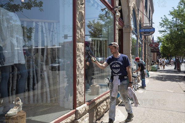 Steamboat Springs, Colorado, Men wash windows at downtown stores