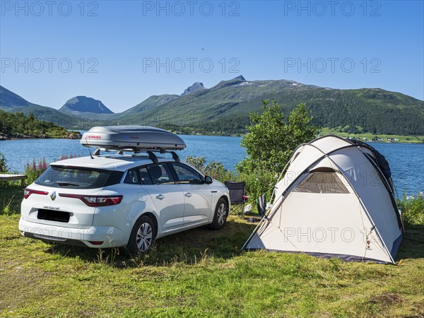 Stønnesbotn fjord, view from Fjordbotn campsite to mountain range, tourists camp in larger family