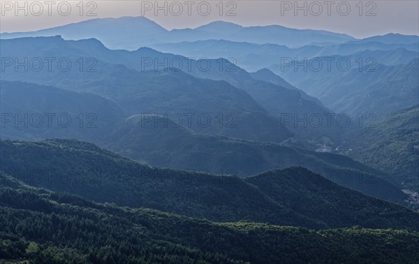 Mountain landscape on the edge of the Pian Grande di Castelluccio di Norcia plateau in the Monti