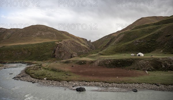 Yurt by a river, Desolate mountain landscape, Tian Shan, Sky Mountains, Sary Jaz Valley,