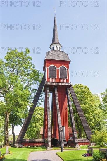 Wooden belfry at Habo Church with a churchyard on the swedish countryside, Habo, Sweden, Europe