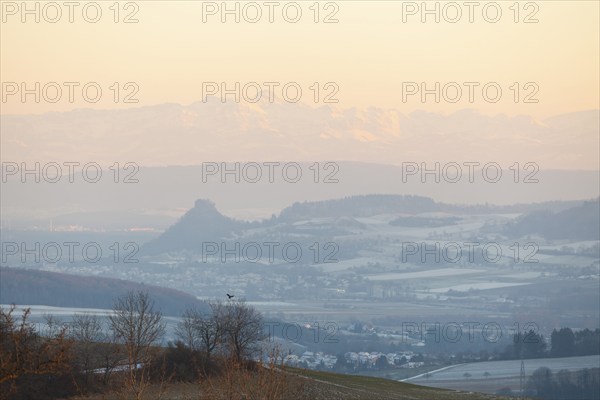 Hegau view in winter with the Alps and the Säntis. Alpenglow at sunset