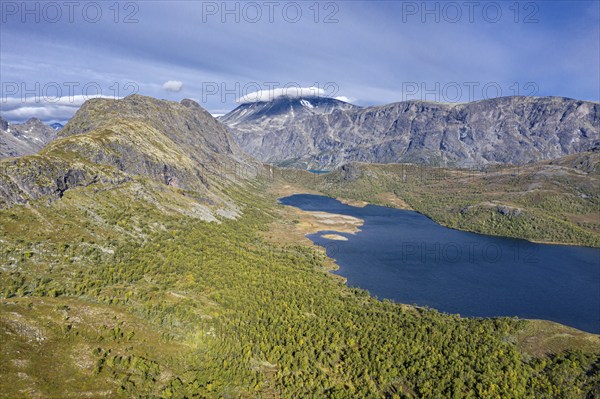 Aerial view of lake Ovre Leirungen, Mt. Besshø (or Besshøe) and famous Besseggen ridge in the back,