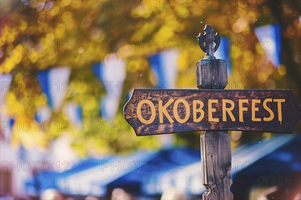 Sign with text 'Oktoberfest' at entry of traditional Bavarian German festival. Generative AI, AI