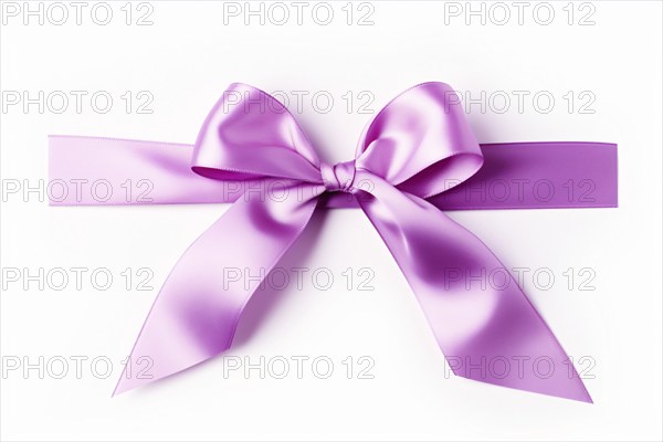 Purple silk ribbon on white background. KI generiert, generiert AI generated