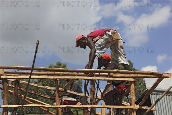 South Ethiopia, two men on a building site, house building, wooden construction, Ethiopia, Africa
