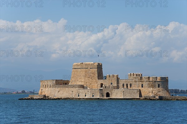 Old castle on a small island in the blue sea under a cloudy sky, fortress, Bourtz island, Bourtsi,