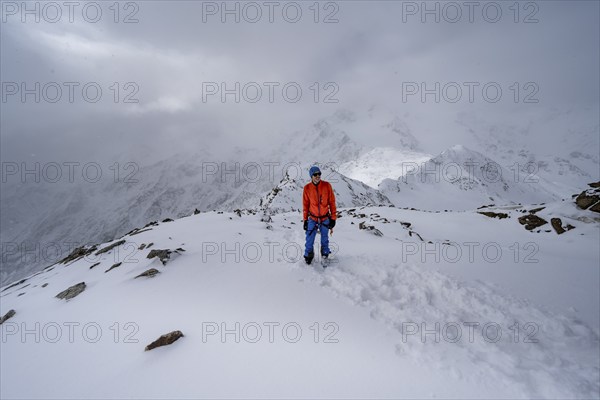 Ski tourers on the summit of the Köllkuppe or Cima Marmota, snow-covered mountain landscape, Ortler