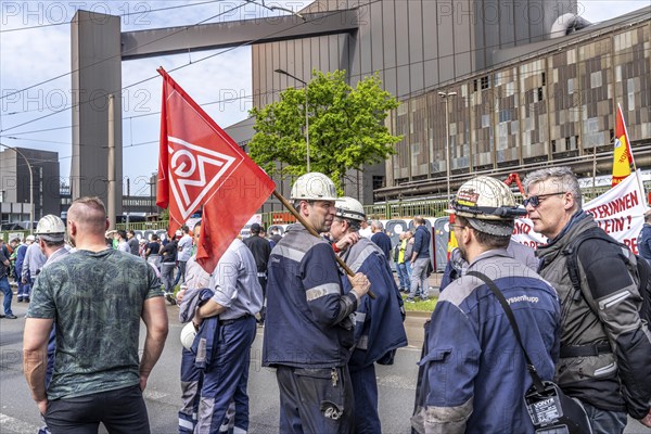 Steelworkers at a demonstration in front of the headquarters of ThyssenKrupp Steel Europe in