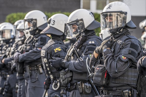 Police officers, police task force, on duty at the demonstration against the AFD party conference