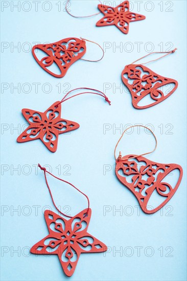 Christmas or New Year composition. Decorations on a blue pastel background. Side view, close up