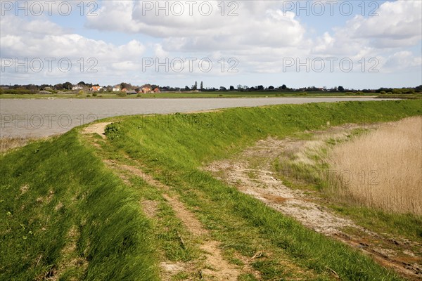 Flood defence embankment wall River Alde, Aldeburgh, Suffolk, England, United Kingdom, Europe