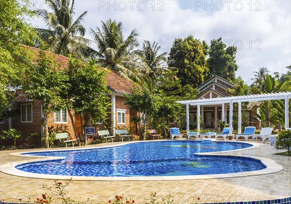 Swimming pool with blue water at the tropical hotel in Vietnam