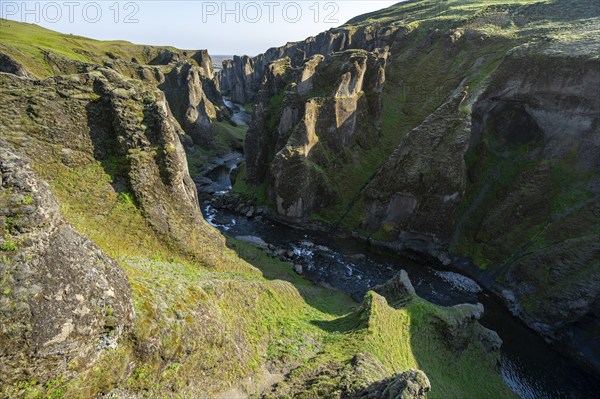 Fjaðrárgljúfur Canyon, Fjadrargljufur, rock formations in rugged deep canyon with river in the