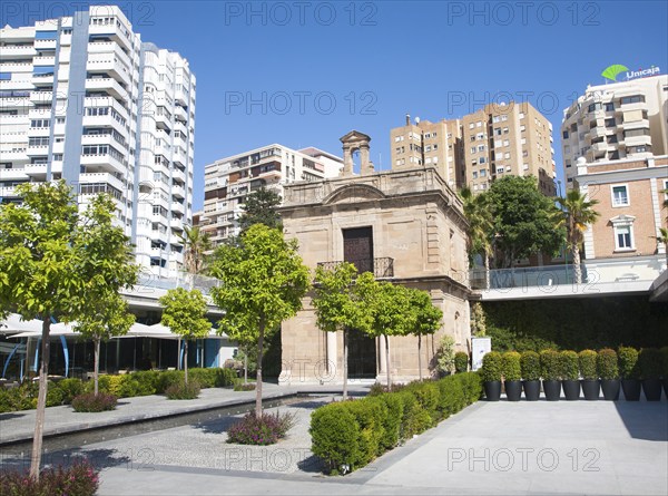 Old chapel surrounded by newly redeveloped port area of shops and bars Malaga, Spain, Muelle dos,