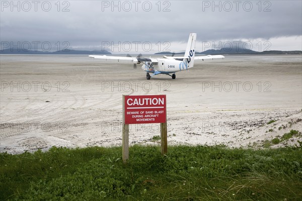 Flybe plane on sandy airstrip Isle of Barra airport, Barra, Outer Hebrides, Scotland, UK
