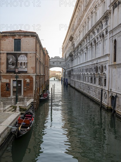 Venetian gondolas on the Rio di Palazzo canal with Bridge of Sighs, Venice, Veneto, Italy, Europe