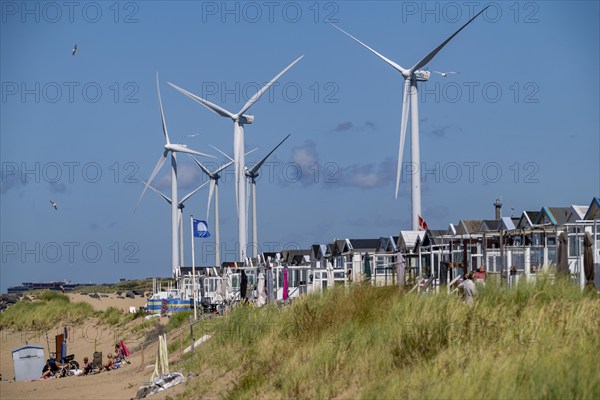 Wind turbines, wind farm, holiday homes, beach houses on the beach of Ijmuiden in North Holland,