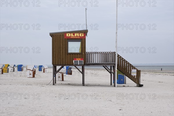 Beach chairs on the sandy beach, DLRG water rescue tower, North Sea, Utersum, Föhr, North Sea