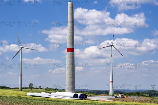 Wind farm near Brilon-Radlinghausen, new wind turbine being built, tower elements and rotors ready
