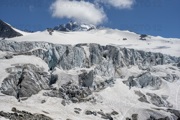 High alpine mountain landscape, Glacier du Tour, glacier with crevasses and mountain peak, summit