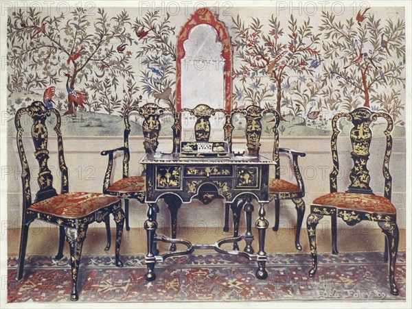 Furniture around the turn of the century 1900, Sofa, chairs and table in black lacquer, mirror in