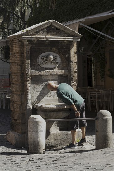 Public drinking water fountain in the historic centre of Rome, Italy, Europe