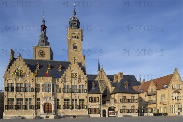 Market square showing town hall with belfy and St Nicholas Church tower, rebuilt after WWI in the