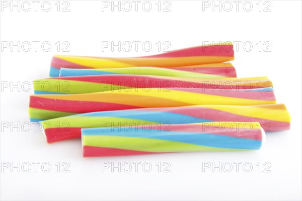 Rainbow chewing caramel sugar candies isolated on white background. top view