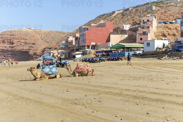 Sandy beach and buildings, Legzira, southern Morocco, north Africa