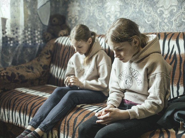 Sveta and Ira in their family home in Voloska Balakliia. The village is close to the front line,