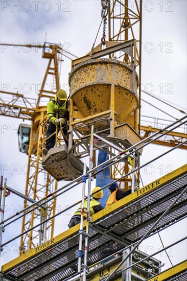 Concreting work on a construction site, new construction of a high-rise office building, facade of