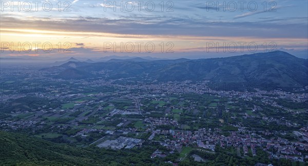 View of the densely populated Neapolitan region and the mountains near Caserta at dusk. San Felice