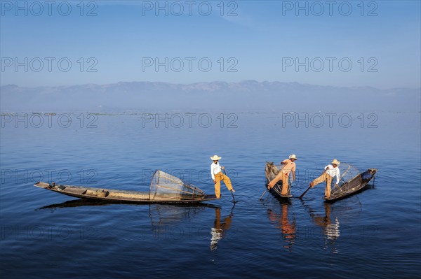 Myanmar travel attraction landmark, Traditional Burmese fishermen with fishing nets on boats at