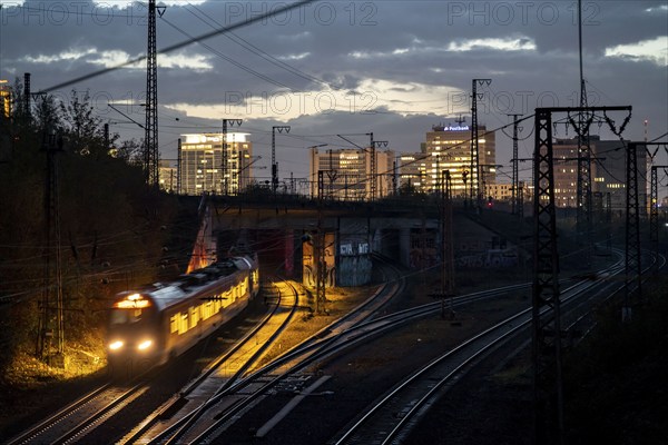 Skyline of Essen city centre, railway facilities in front of the main station, regional train,