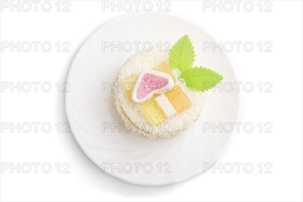 Decorated cake with milk and coconut cream isolated on white background. Side view, close up