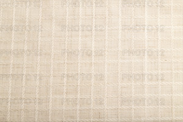 Fragment of smooth white linen tissue. Top view, flat lay, natural textile background and texture
