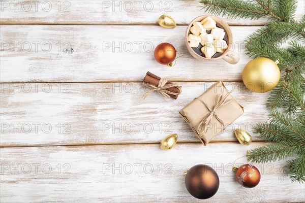 Christmas or New Year composition. Decorations, box, golden balls, cinnamon, fir and spruce