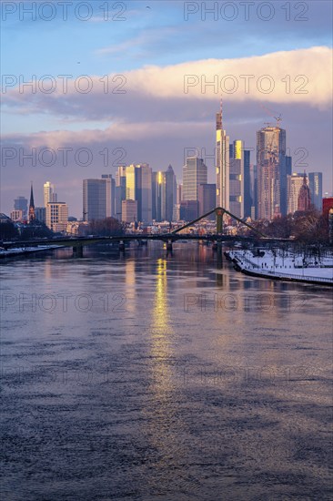 The skyline of Frankfurt am Main, skyscrapers of the banking district, Flößerbrücke, wintry
