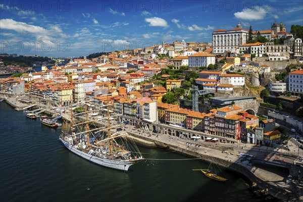 Aerial view of Porto city and Douro river with moored sailling ship from Dom Luis bridge I. Porto,